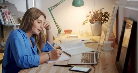 Nice female using language translation application in smart phone sitting at Stock Footage 119385410