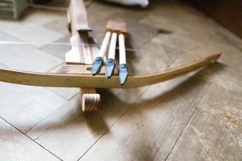 Nice front view close up of arrows and crossbow Stock Photos