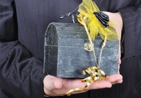 Nice gift chest in hands Foto stock
