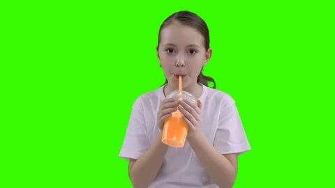 Nice girl drinking through a straw drink. Green screen Stock Footage 87389137