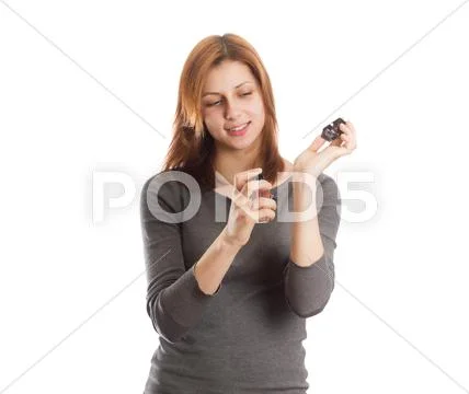 Nice girl evaluates perfume Stock Photos
