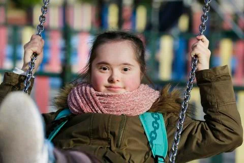 Nice girl having fun on the playground Stock Photos