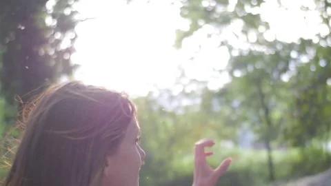 Nice girl playing in park in spring Video stock 73499508
