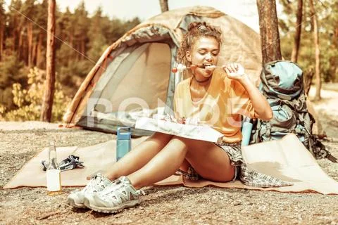 Nice good looking woman having her meal Stock Photos