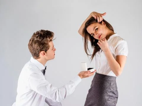 A nice guy makes an offer to marry a beautiful girl. Stock Photos
