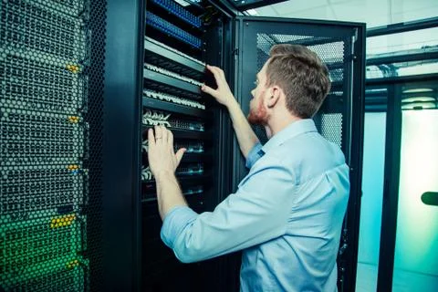 Nice handsome man looking at the server Stock Photos