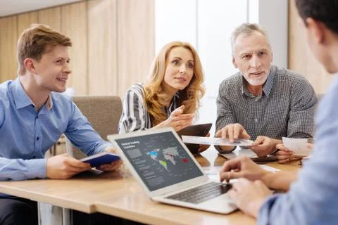 Nice hard working man using a laptop Stock Photos