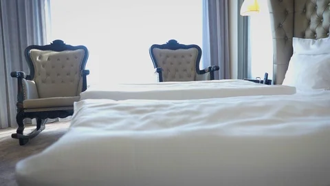 Nice hotel room interior with large bed Stock Footage 107381200