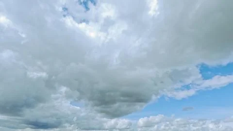 Nice huge white clouds in the blue sky backdrop - photo of nature Stock Photos