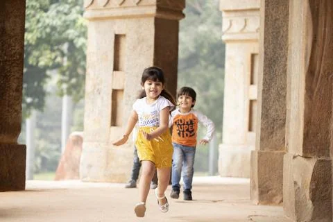 Nice Kids Playing And Having Fun On Sunny Summer Day In Casual Clothes 스톡 사진