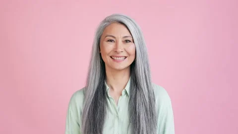 Nice lady glad granny look in camera isolated pastel color background Stock Footage 165348307