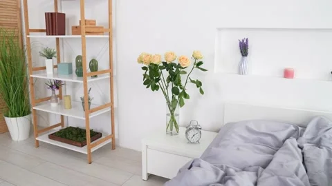 Nice lady lyaing silky soft bed awakening use device typing post in room Stock Footage 166997190