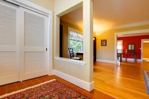 Nice large open hallway and living room with red wall Stock Photos