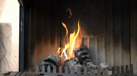 Nice little fire burns lightly in the fireplace Stock Footage 36478232