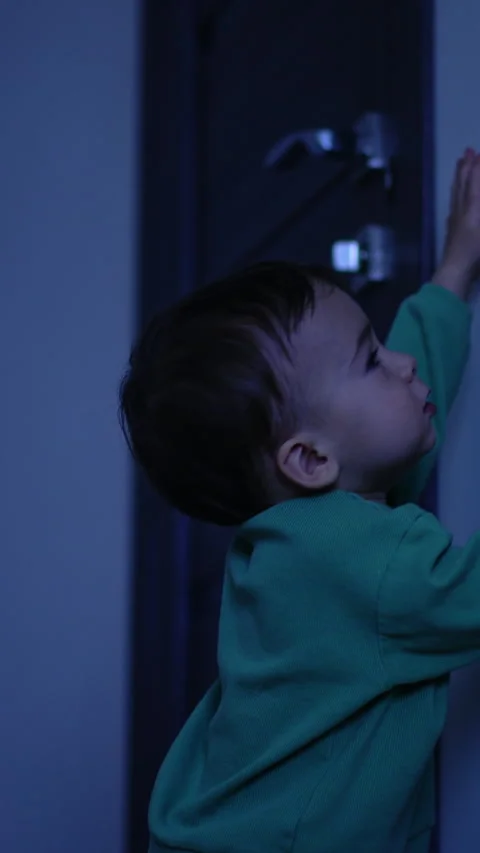 Nice little kid switches off the light in the room.  Stock Footage 293141105