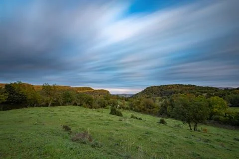 Nice long exposure picture, cloudscape over the mountain in sunset and autumn Stock Photos