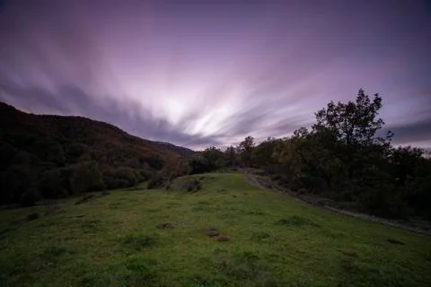 Nice long exposure picture, cloudscape over the mountain in sunset and autumn Stock Photos