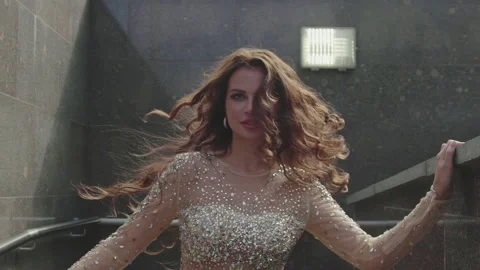 Nice-looking beautiful elegant young woman spinning outside. Stock Footage 161567301