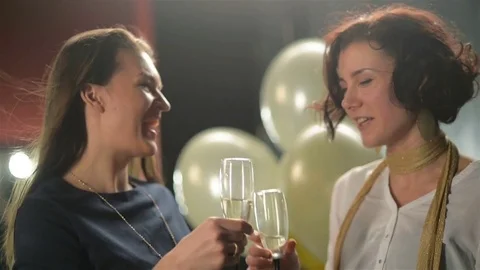 Nice-looking Brunettes are Talking to Each Other During Disco Party and Clinking Stock Footage 71783652