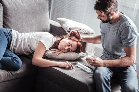 Nice loving man caring about his wife Stock Photos