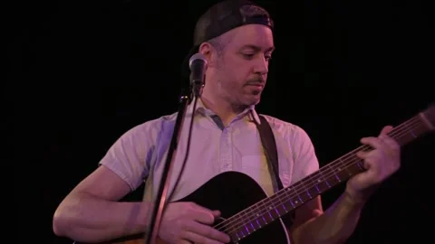 A nice Man playing guitar at a bar Stock-Footage 143047475