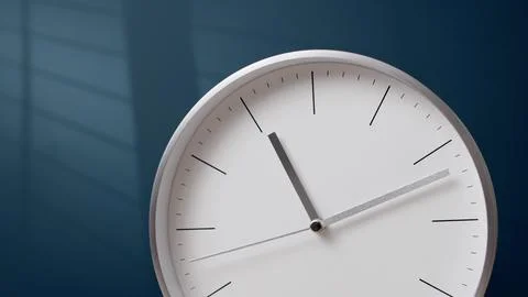 Nice metal hands of white clock go forward. wall clock shows time Stock Photos