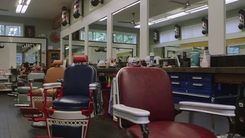 Nice moving shot inside an old fashioned americana barber shop. Stock Footage 83982568
