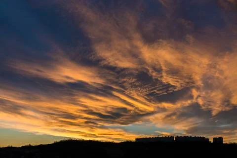 Nice orange colored sunset over the city Stock Photos