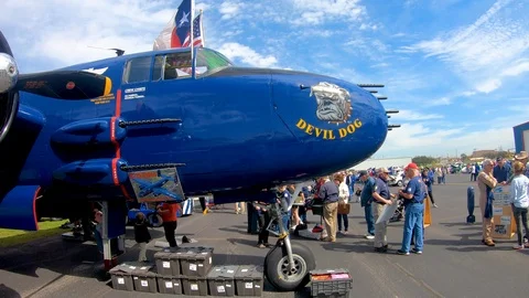A nice panning shot of the B-25 Devil Dog at the Air and Auto show Stock Footage 126078910