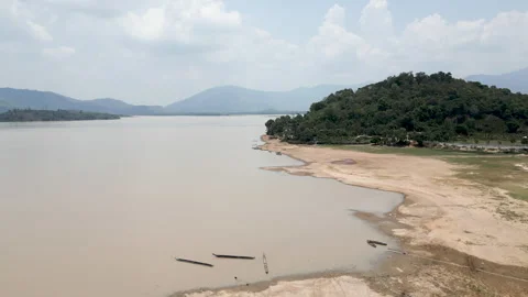 Nice panoramic drone view over the big lake near the canoes and the forest Stock-Footage 276626177