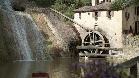 Nice panoramic view of molinetto della Croda at sunset - mill Refrontolo - 4k Stock Footage 115889147