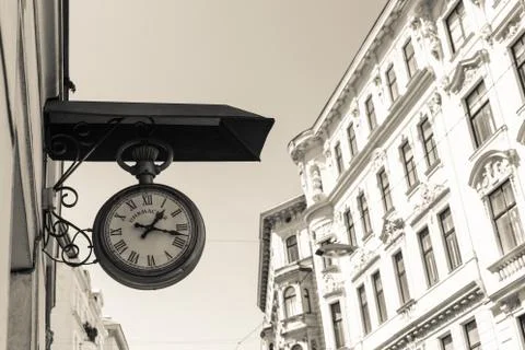 Nice photo of old clock with a building in the background Stock Photos