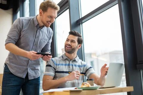 Nice pleasant men talking to each other Stock Photos