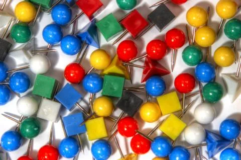 Nice polychromatic pushpin on white 스톡 사진