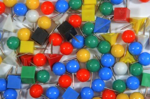 Nice polychromatic pushpin on wite 스톡 사진