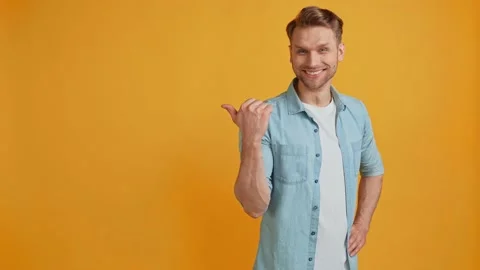 Nice positive guy direct finger empty space novelty banner approve gesture 動画素材 161702967