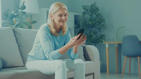 Nice positive lady sit couch read telephone news blog Stock Footage 166904290