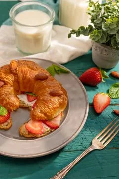Nice presentation of breakfast for one person. On a turquoise napkin, an appe Stock Photos
