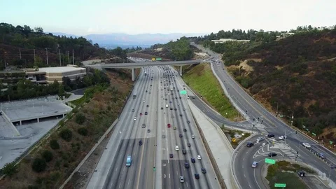 Nice pull down and tllt up on the freeway Stock Footage 83233585