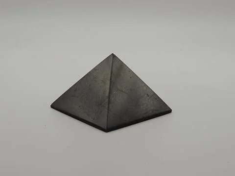A nice quartz and shungite pyramids Stock Photos