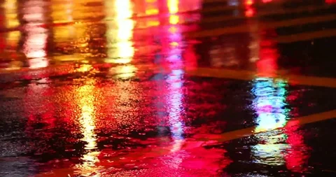 Nice Raining Background and Reflection of Colorful Lights in Water Stock Footage 108865895