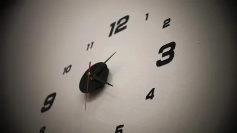 A nice running clock with a dial mounted on a wall Stock Footage 329824308