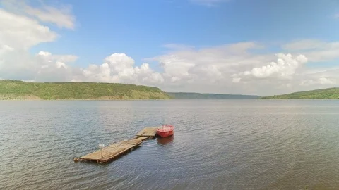 A nice scenic view on wide river with small red rescue boat Stock Footage 99075241