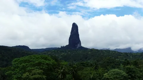 A nice side-angle drone shot of Pico Cão Grande on the paradise island of São Stock Footage 346000285