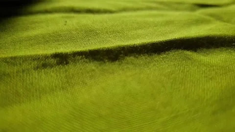 Nice slow motion shot when running on a green surface with shadow on sunlight. Stockbeeldmateriaal 143773646