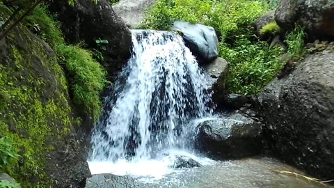 Nice small waterfall stream on the side of big river on the mountain Stock Footage 125295374