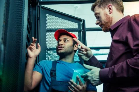 Nice smart people discussing a technical problem Stock Photos
