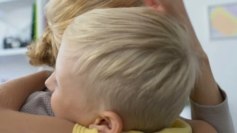 Nice smiling boy hugging mother, love and care, warm family relationship Stock-Footage 119035897