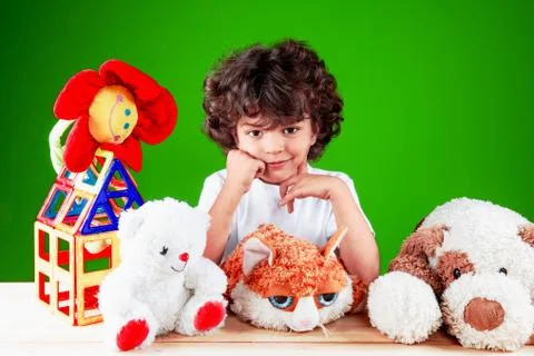 The nice smiling kid having propped up the head hands together with the frien Stock Photos