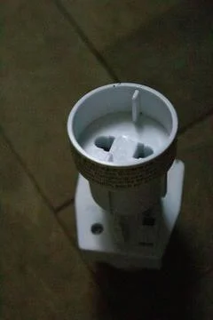 Nice socket plug adapters isolated on wood background Stock Photos